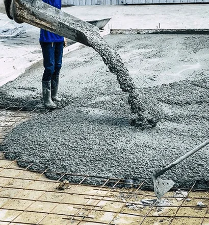 Fresh concrete pouring on pavement construction